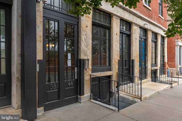 view of exterior entry featuring french doors