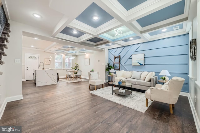 living room with beam ceiling, coffered ceiling, and dark hardwood / wood-style flooring