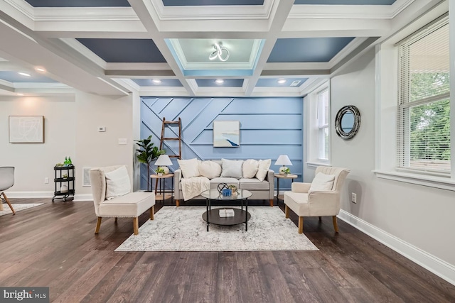 living room featuring coffered ceiling, dark wood-type flooring, crown molding, and beam ceiling