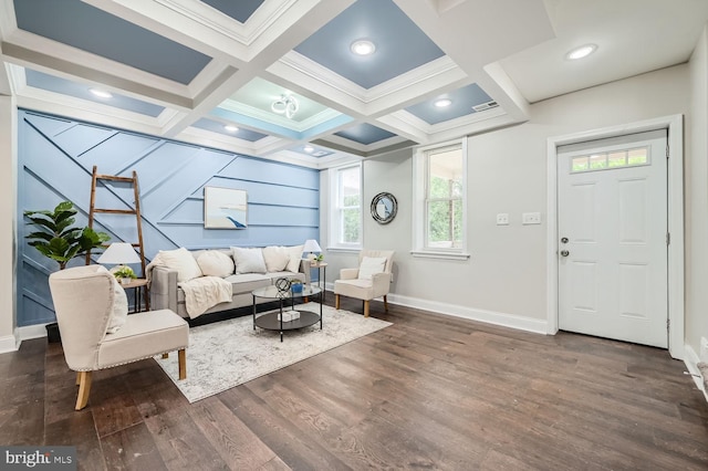 living room with dark wood-type flooring, coffered ceiling, and beamed ceiling