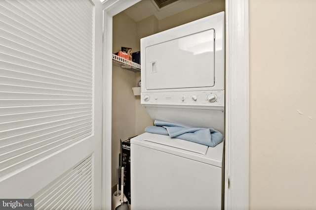 laundry area featuring stacked washer and dryer