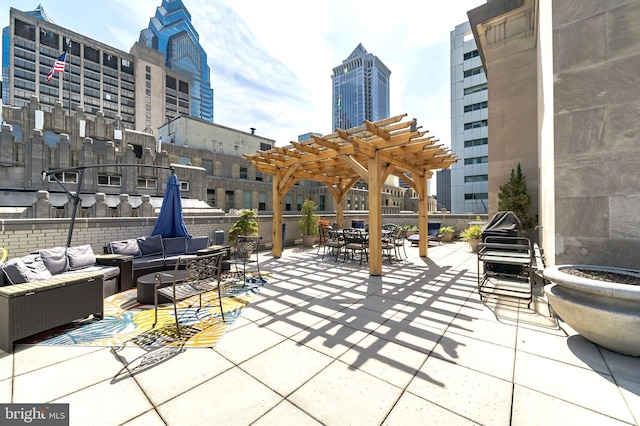 view of patio / terrace featuring an outdoor hangout area and a pergola