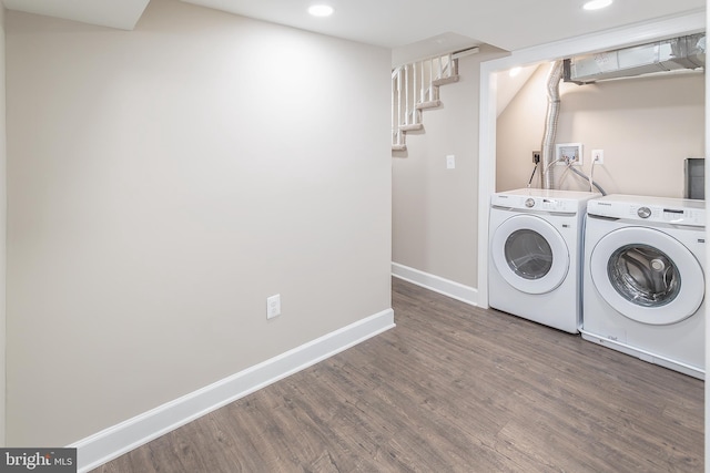 laundry area featuring dark wood-type flooring and independent washer and dryer