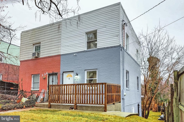 back of house with a yard and cooling unit