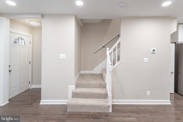 foyer with dark hardwood / wood-style flooring