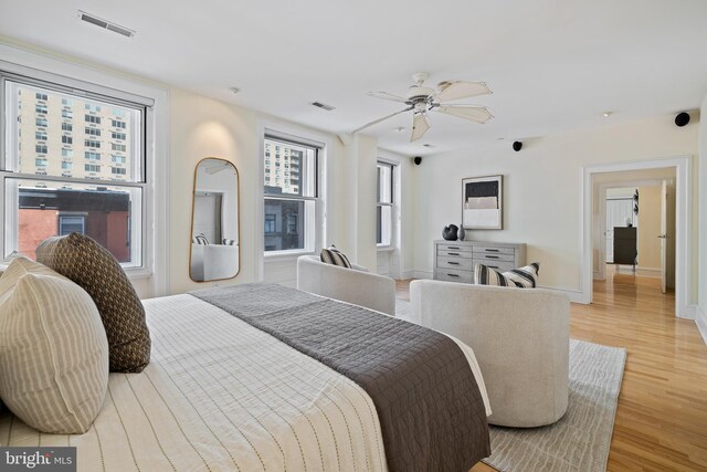 bedroom featuring ceiling fan and light wood-type flooring