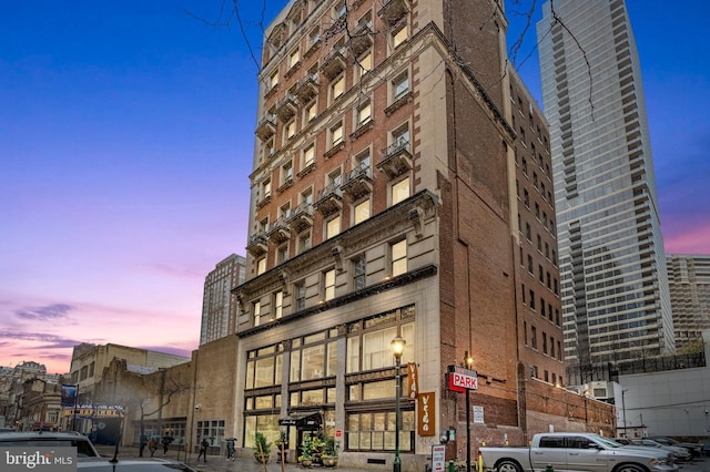 view of outdoor building at dusk