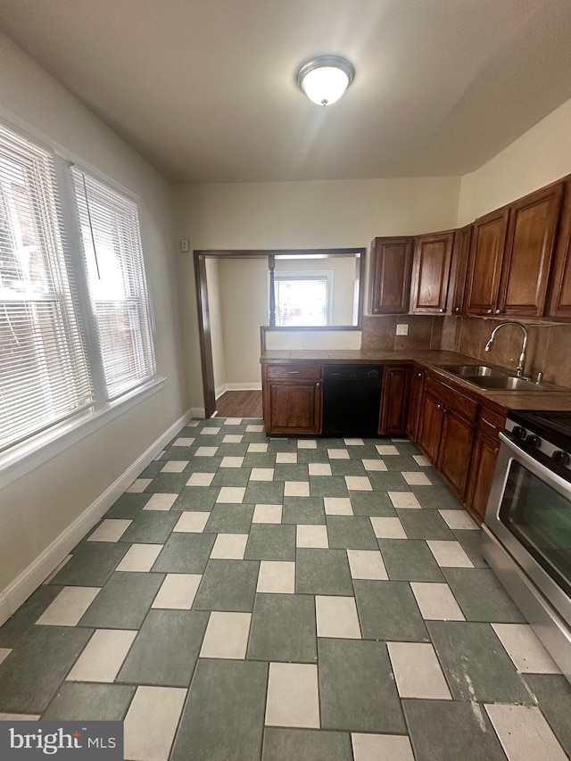 kitchen with black dishwasher, sink, stainless steel range oven, and decorative backsplash