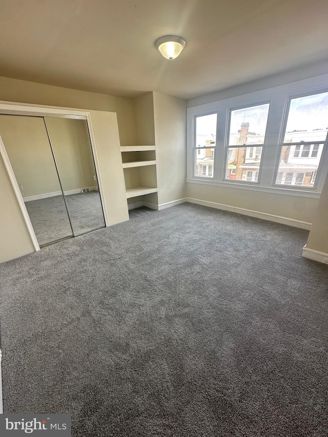 unfurnished bedroom with carpet floors