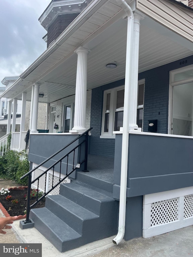 entrance to property with a porch