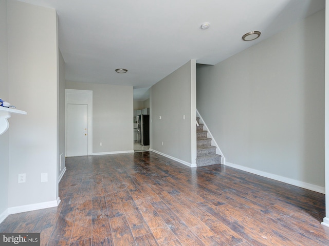 unfurnished living room featuring wood-type flooring