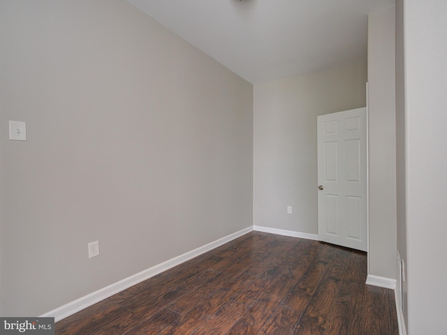 unfurnished room featuring dark hardwood / wood-style flooring