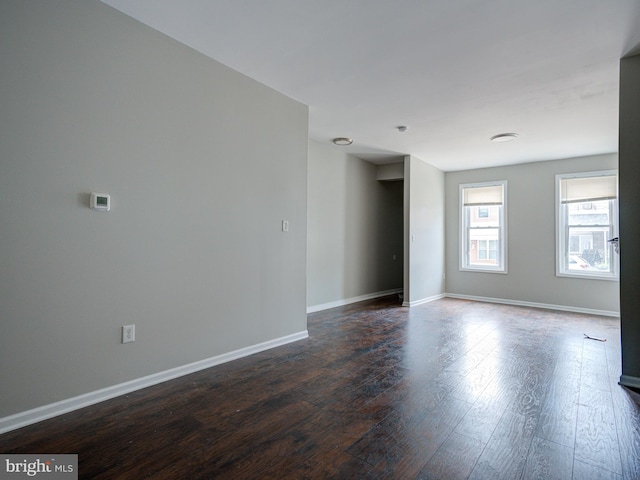 unfurnished room featuring hardwood / wood-style flooring