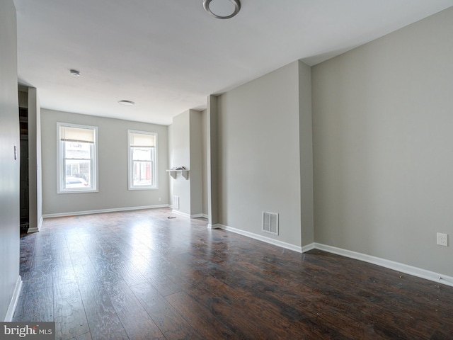 empty room with hardwood / wood-style flooring