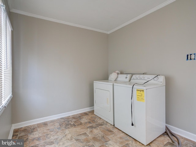 washroom with light tile patterned flooring, washing machine and clothes dryer, and ornamental molding