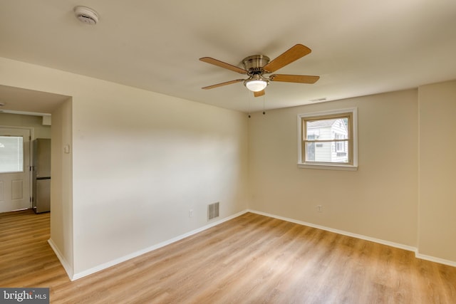 unfurnished room featuring ceiling fan and light hardwood / wood-style flooring