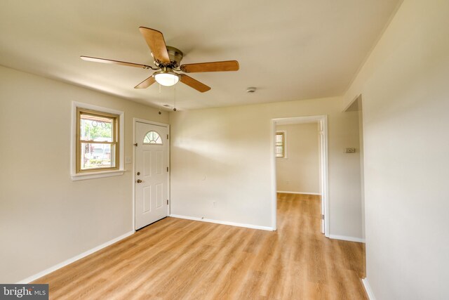 entryway with ceiling fan and light hardwood / wood-style flooring