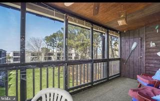 sunroom featuring a wealth of natural light and wood ceiling