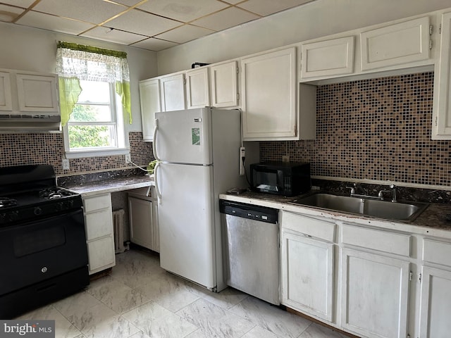 kitchen with tasteful backsplash, black appliances, white cabinets, sink, and light tile patterned floors