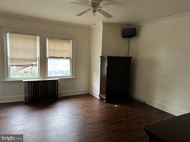 spare room with ornamental molding, radiator heating unit, hardwood / wood-style flooring, and ceiling fan