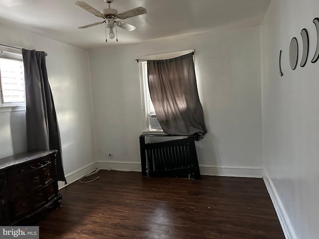 interior space with hardwood / wood-style floors and ceiling fan