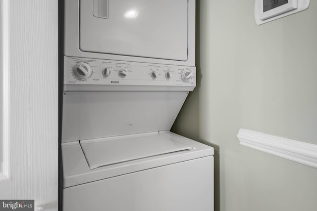 laundry room with stacked washer and clothes dryer