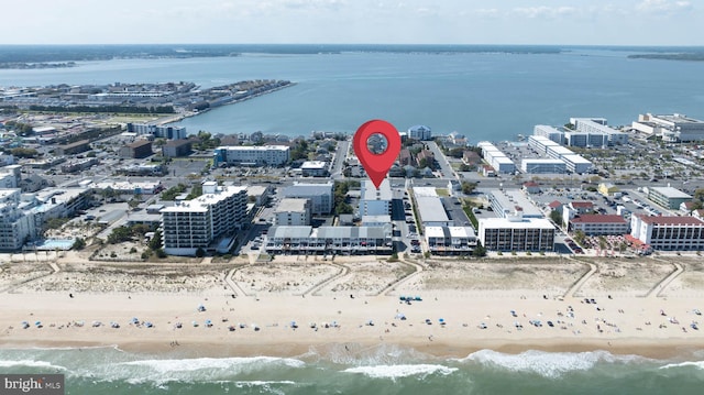 bird's eye view featuring a view of the beach and a water view