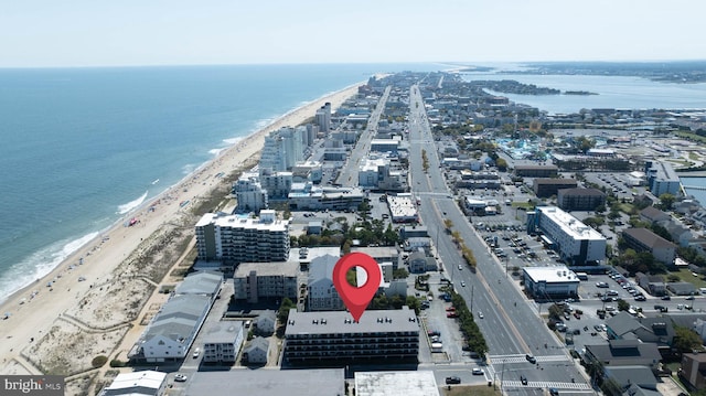 bird's eye view featuring a view of the beach and a water view