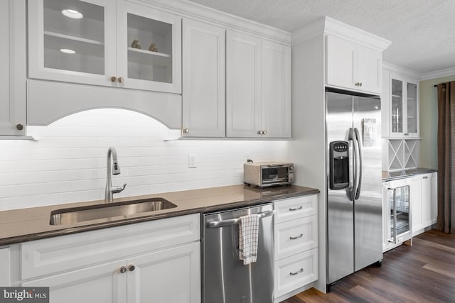 kitchen featuring wine cooler, dark hardwood / wood-style floors, sink, white cabinets, and stainless steel appliances