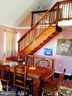 dining area featuring vaulted ceiling