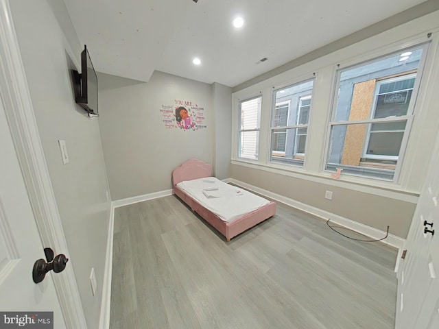 unfurnished bedroom with light hardwood / wood-style floors