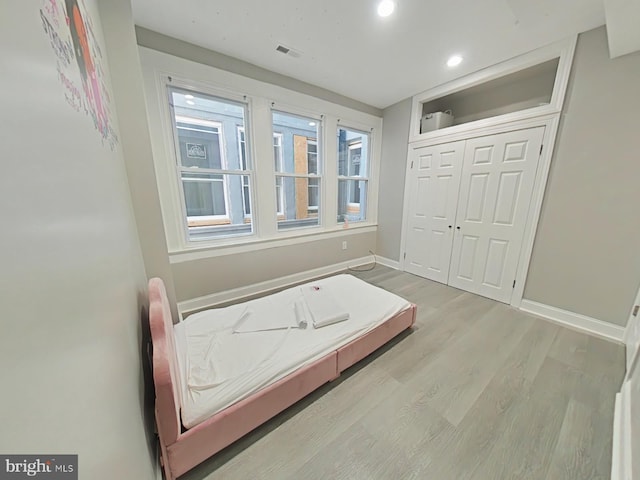 bathroom featuring hardwood / wood-style flooring