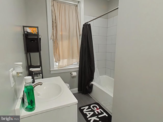 bathroom featuring vanity and shower / tub combo