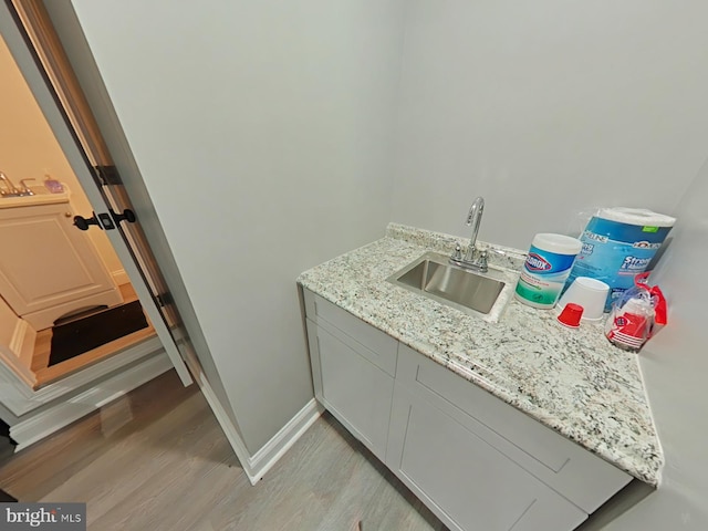 bathroom with vanity and hardwood / wood-style floors