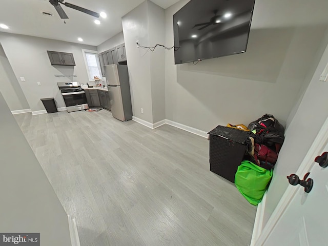 interior space featuring light wood-type flooring and ceiling fan