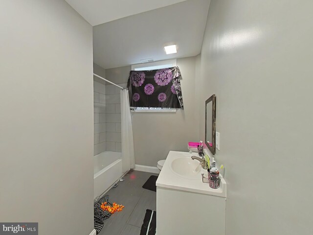 full bathroom with vanity, toilet, and shower / bath combination with curtain