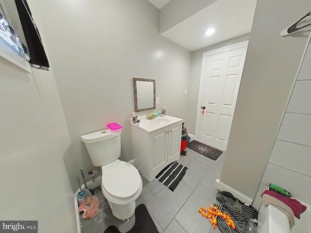 bathroom featuring vanity and toilet