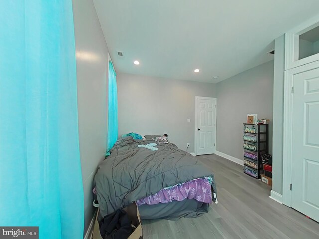 bedroom featuring wood-type flooring