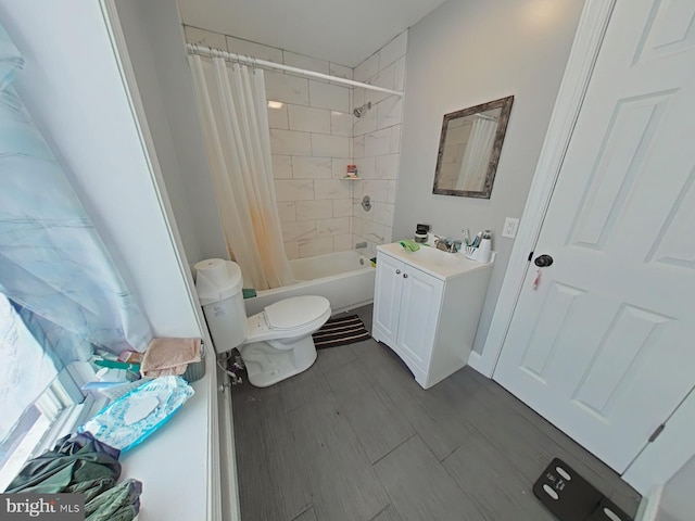 full bathroom with shower / tub combo, vanity, and toilet