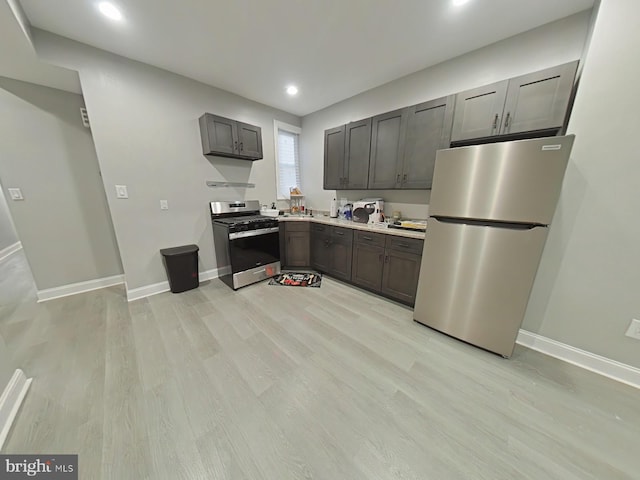 kitchen featuring stainless steel appliances and light wood-type flooring