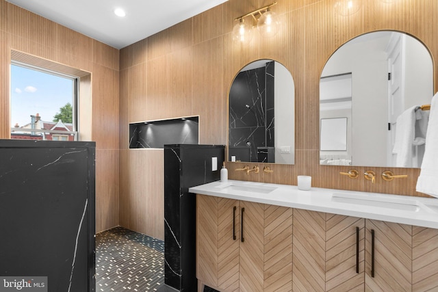 bathroom featuring vanity and backsplash