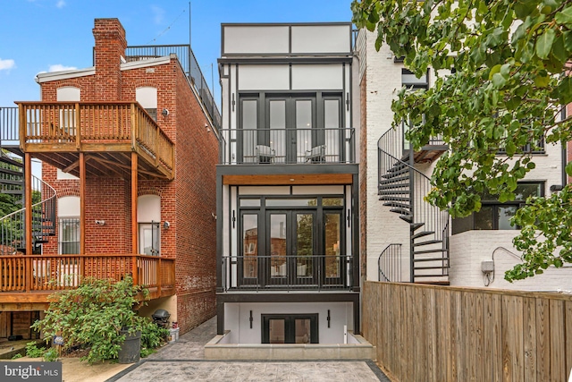 rear view of property with a balcony