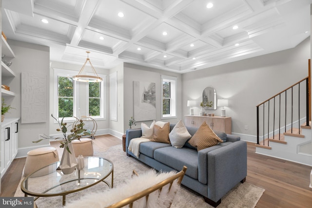 living room with wood-type flooring, coffered ceiling, and beam ceiling