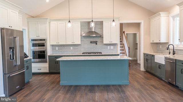 kitchen with white cabinetry, a kitchen island, and appliances with stainless steel finishes