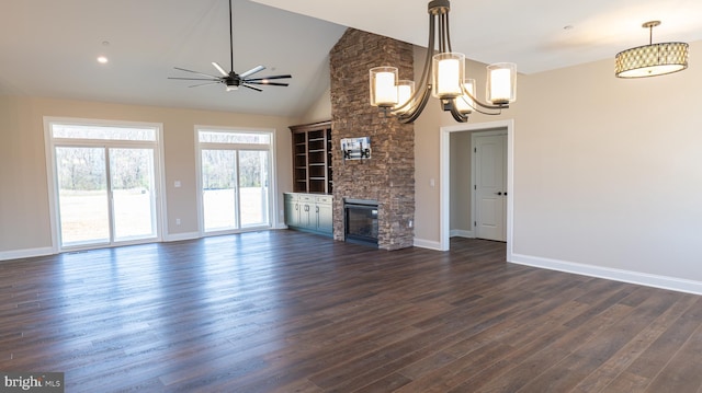 unfurnished living room featuring high vaulted ceiling, baseboards, dark wood-style flooring, and a stone fireplace