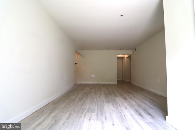 additional living space with light wood-type flooring