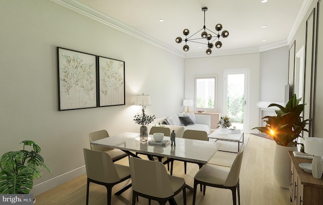 dining area with a notable chandelier, crown molding, and light hardwood / wood-style flooring