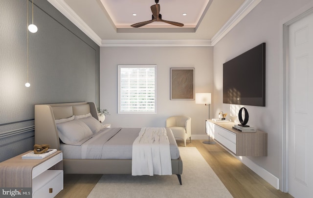 bedroom with crown molding, ceiling fan, a raised ceiling, and light hardwood / wood-style floors