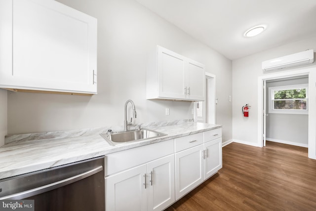 kitchen featuring white cabinets, sink, a wall mounted AC, and dishwasher