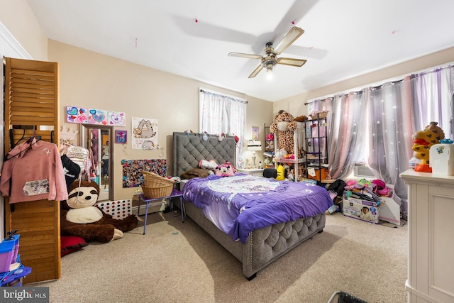 bedroom with light colored carpet and ceiling fan